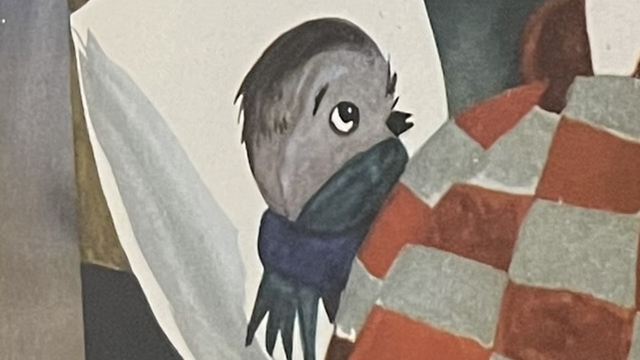 『Spatzchen Schwatz』の絵本のページの写真です。スズメのシュワルツがベッドに寝ているイラストが描かれています。
