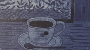 『星屑珈琲』の本のページの版画です。コーヒーカップが描かれれています。