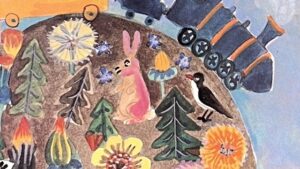 『En sortant de l'ecole』の絵本の表紙のイラス雄です。地球の上のいろんな動物、植物が描かれています。