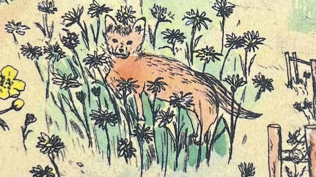 『赤毛のアンの贈り物』の本の表紙のイラストです。お花の中のネコが描かれています。