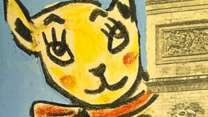 『BON BAISER DE PARIS』の本のページのイラストです。凱旋門の写真の大きな猫の絵がコラージュされています。