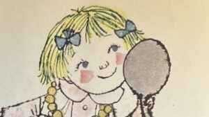 『Karen's OPPOSITES』の絵本のページです。女の子が手鏡を覗きこんでいます。