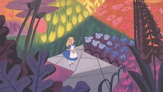 『メアリー・ブレア展』の図録の表紙です。色鮮やかな世界に女の子が描かれています。