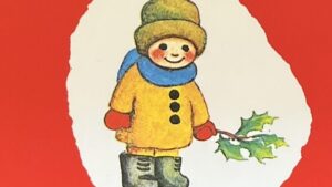 『エリーちゃんのクリスマス』の絵本の表紙です。ヒイラギの葉っぱを持ってマフラーに手袋といった暖かい格好をした小さな男の子が描かれていいいます。