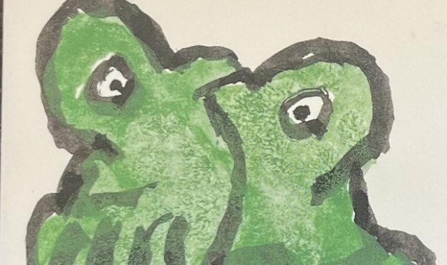 『あ・うん』の本の表紙です。緑の鳥が向き合ってくっついている絵が描かれています。